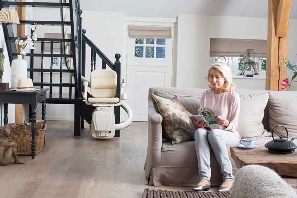 Handicare Woman Reading Stairlift HR